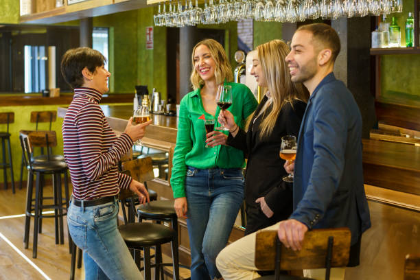 istock Happy friends chatting in a beautiful bar 1399572797