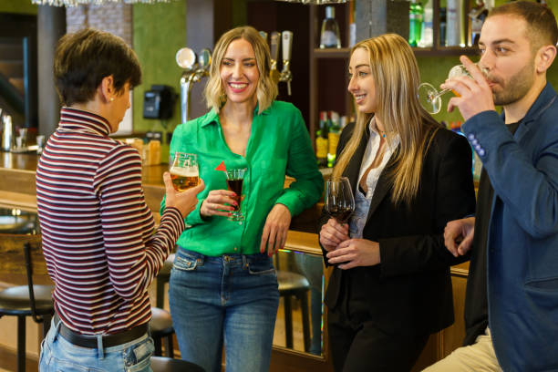 istock Friends drinking alcohol and speaking in bar 1399572801