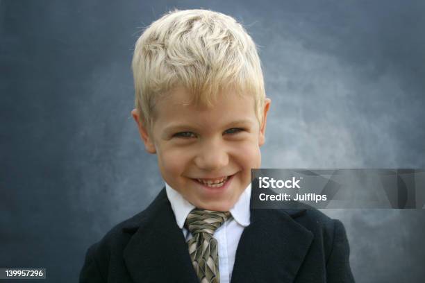Blond Grinning Business Boy Stock Photo - Download Image Now - Black Color, Blond Hair, Boys