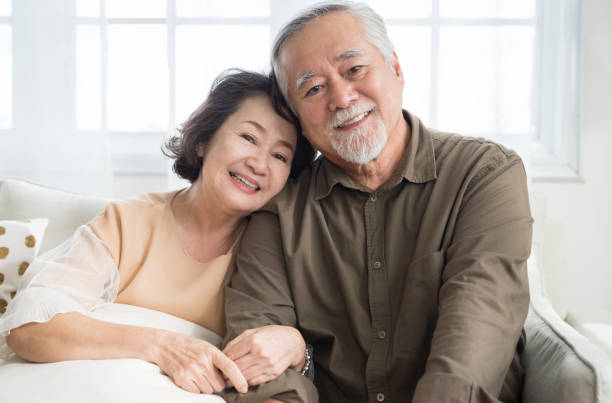 Asian senior couple smiling at the camera. Family mature couple portrait stock photo