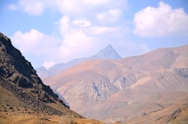 Kashmir beauty green hills forests in mountains. summer landscape with green grass on the hills. nature scenery on a sunny day with clouds on the sky