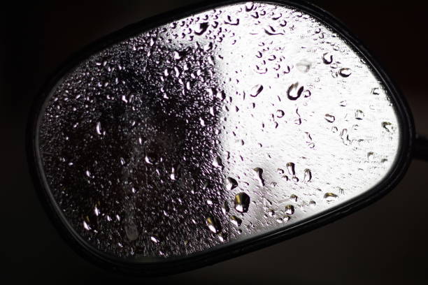 raindrops on the motorcycle mirror during the day