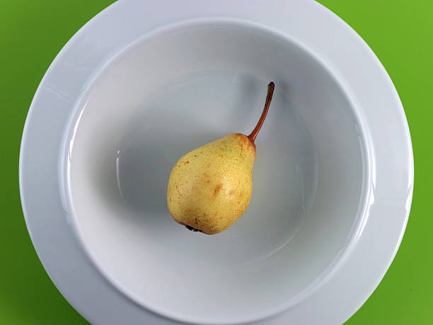 Diet! Pear on porcelain stock photo