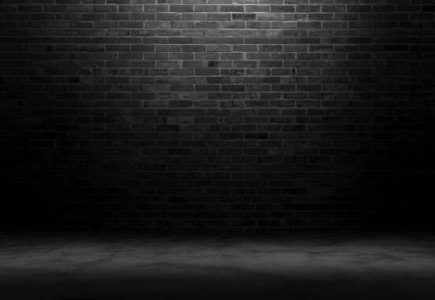istock Black wall room background The surface of the brick dark jagged. Abstract black wall empty room background for interior design and decoration. 1399579474