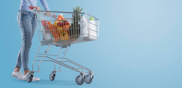 istock Woman pushing a full shopping cart 1399579929