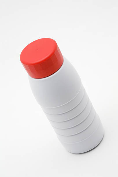 Plastic milk bottle with a red cap stock photo