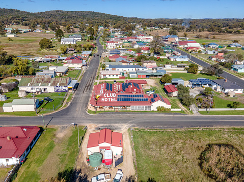 Aerial View of Emmaville, NSW, 2371, Australia. Emmaville's industries are tourism, agriculture, and mining. There is a Mining Museum which includes a collection of mineral specimens and photographs of the town's history. Fossicking is a local tourist activity.\n\nThis neat and tidy village has a post office, general store, two craft shops, a swimming pool, a caravan site and two hotels. Emmaville also has a pre-school and a central public school with 60 primary and 28 secondary pupils. Since 2004 Emmaville School has catered for stage 6 students in year 11 and 12 although all of their studies except English and Maths are supplied by Dubbo school of Distance Education. The Vegetable Creek Hospital in Emmaville has 13 residential beds, 4 acute beds and 2 accident and emergency beds a total of 19 beds and is part of the Hunter New England Local Health District.