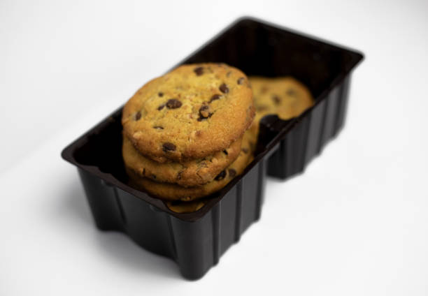 Delicious cookies in individual bags with blank labels, ready for sale in a coffee shop