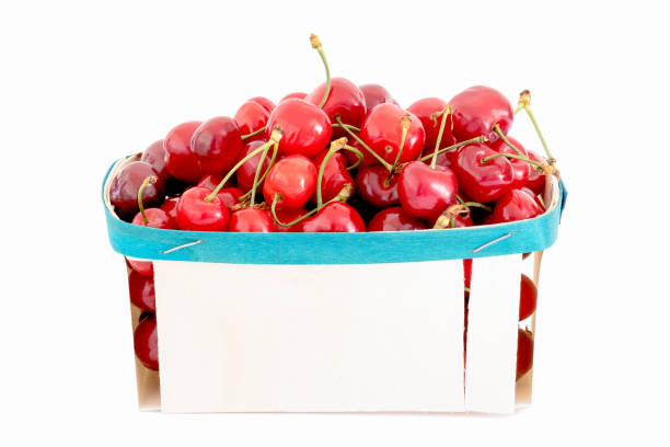 istock cherries in a wooden tray on a white background 1399587388