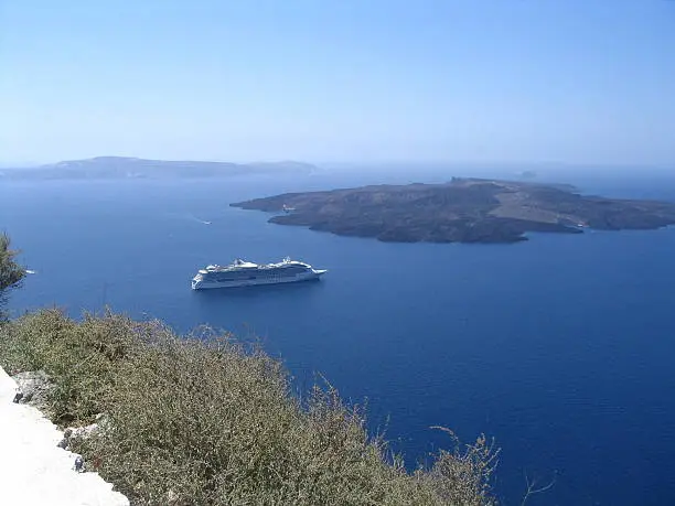 cruise ship on island santorini, greece