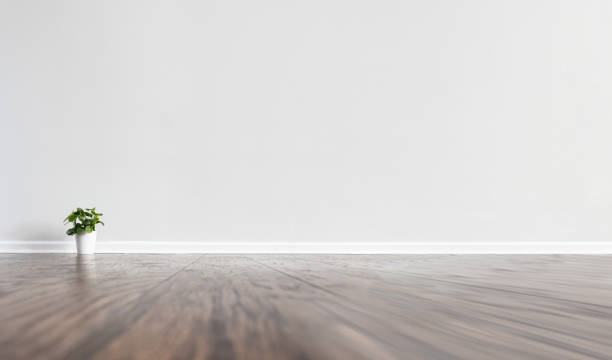 istock Large copy space on white wall of an empty room 1399592996