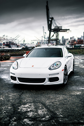 Seattle, WA, USA\n5/25/2022\nPorsche Panamera parked with a crane in the background