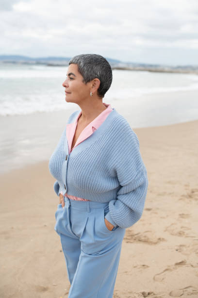 istock Nice-looking woman walking near sea 1399595482