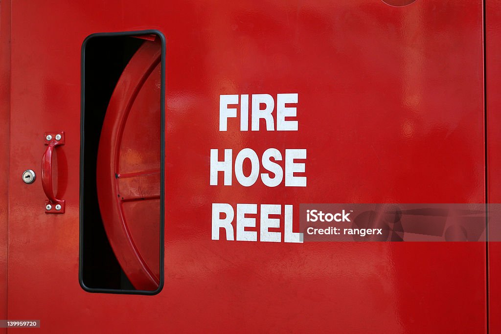 Fire Hose Reel Bright red fire hose reel Accidents and Disasters Stock Photo