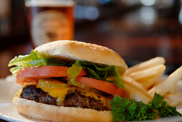 istock Cheeseburger with lettuce and tomatoes and fries 139959903