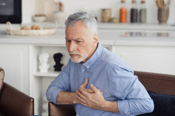 istock Senior man feeling heart pain, holding hands on chest 1399600079