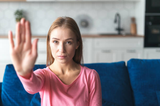 istock Serious woman raising her hand in protest 1399601495
