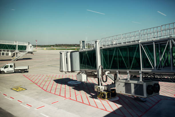 istock Empty airport gate with air bridge and apron 1399602883
