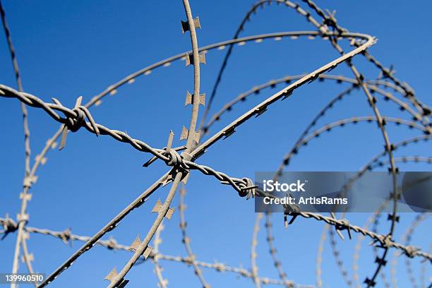 Closeup Of A Fence With Barb Wire Stock Photo - Download Image Now - Crossing, Frame - Border, Mexico