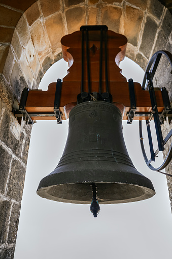 Image of one of the bells in the bell tower of the church.
