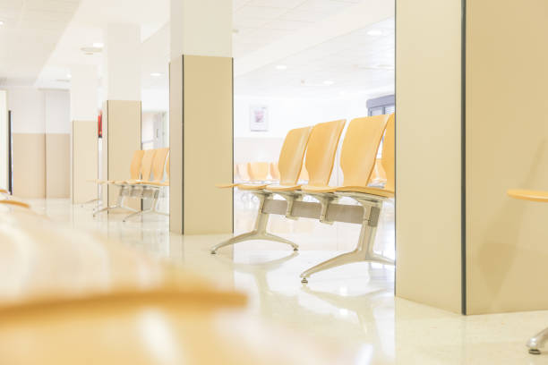istock Hospital waiting room with chairs and reflections on the floor 1399606836
