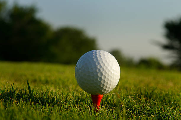 Golf Ball on tee stock photo