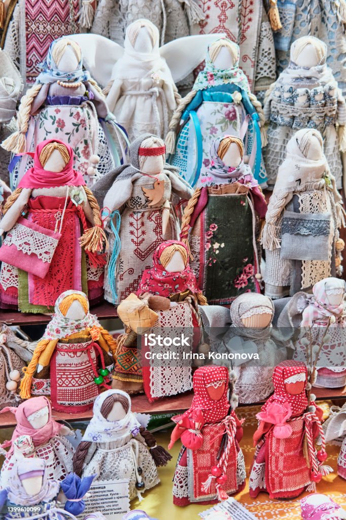 Slavic traditional rag dolls - amulets associated with pagan traditions. Slavic traditional rag dolls - amulets associated with pagan traditions. Handmade souvenirs or gifts on folk crafts fair. Indigenous Species Stock Photo