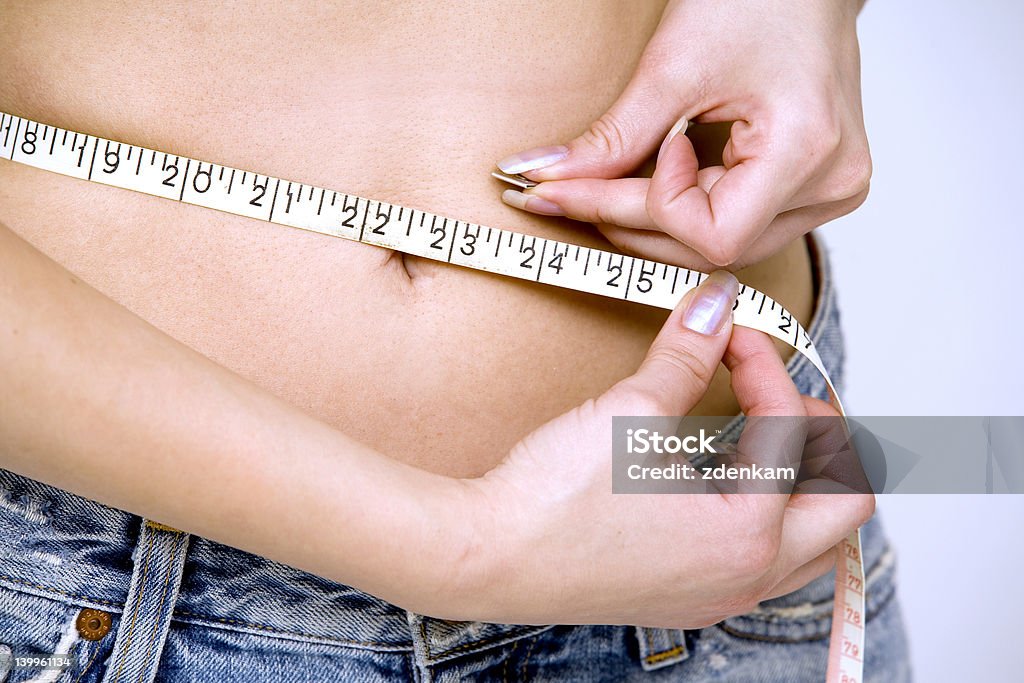 Mädchen messen Ihre Taille - Lizenzfrei Abnehmen Stock-Foto