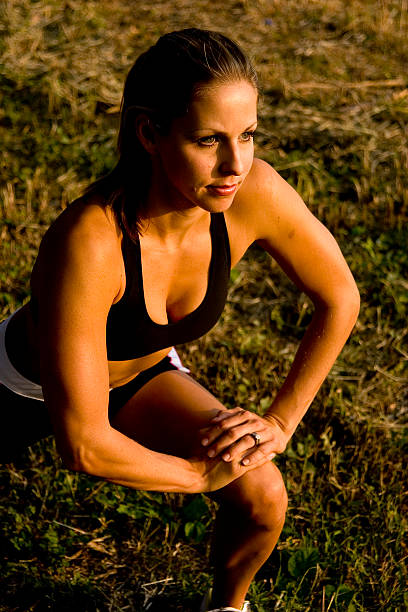 Female stretching before exercise. stock photo