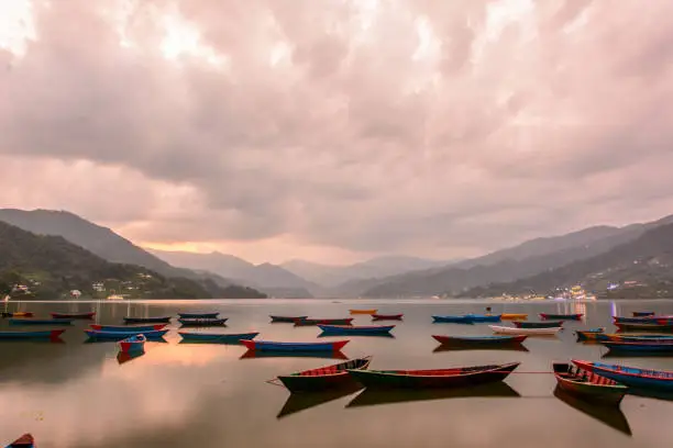 Photo of Beautiful boats and the sun in Nepal, Fewa Lake, Pokhara