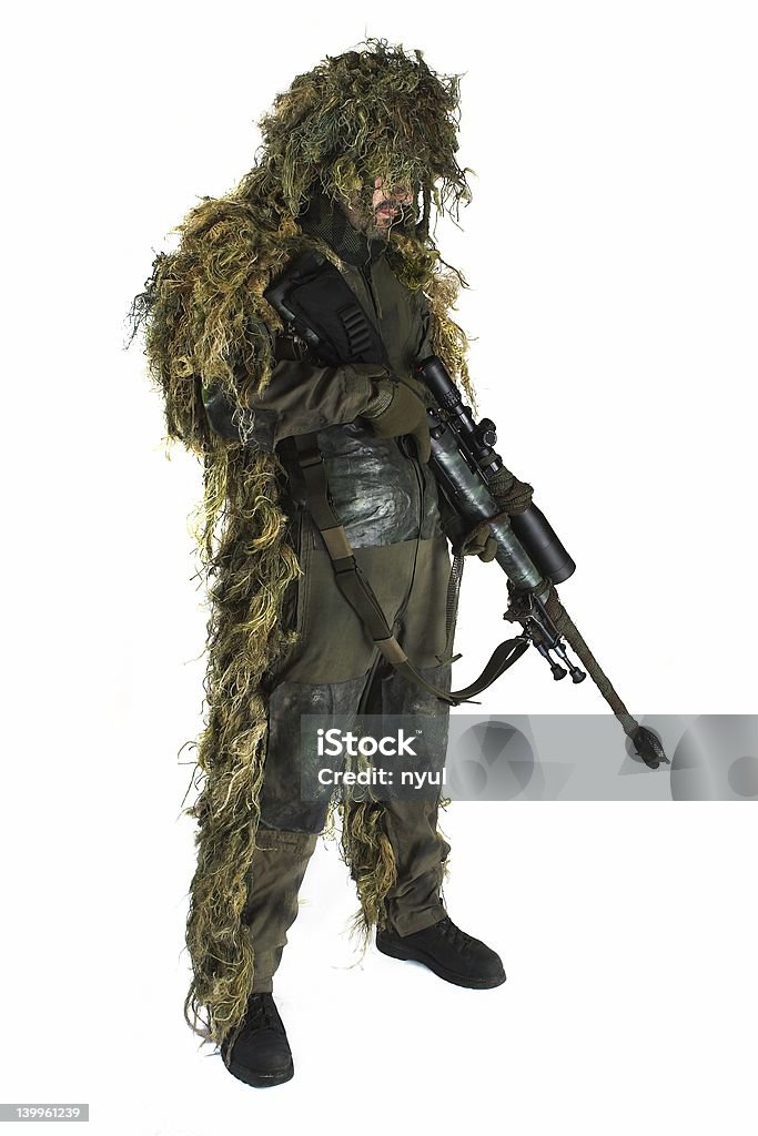 Sniper in ghillie suit Sniper is wearing a ghillie suit. Cut Out Stock Photo