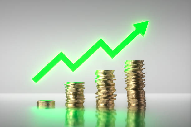 istock 3D render. Stacks of coins with a bright green rising arrow. 1399615602