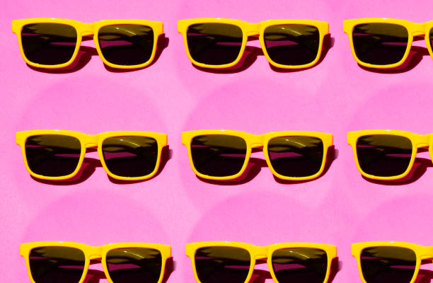 istock yellow sunglasses pattern on pink pastel background. Minimal summer concept. Isometric print 1399615825