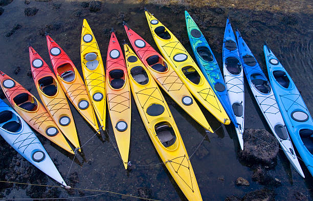 Kayak Rainbow Moored Kayaks in rainbow color.  Location Rockport MA. essex county massachusetts stock pictures, royalty-free photos & images