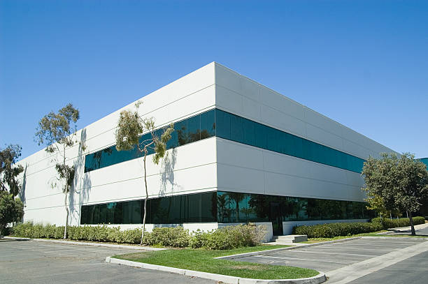 istock Overview of modern office building and empty parking lot 139961657