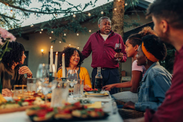istock Family dinner around dining table in the garden 1399619495