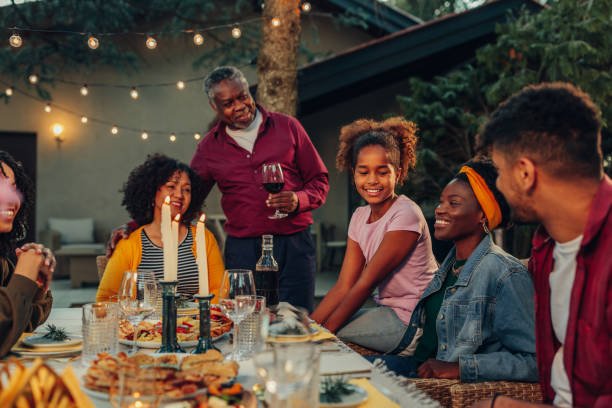 istock Family dinner around dining table in the garden 1399619532