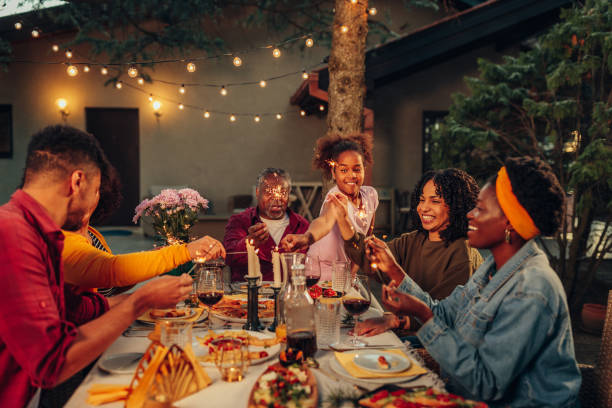 istock Family gathering over dinner in the yard 1399619691