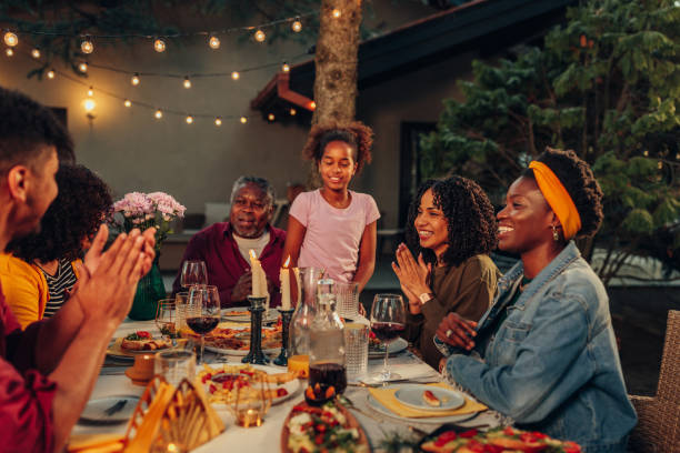 istock Family gathering over dinner in the yard 1399619759
