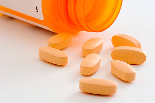 istock Orange Pills and Overturned Bottle 139962250