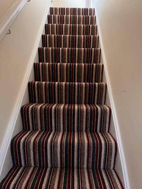 istock A set of striped carpeted stairs 1399623804