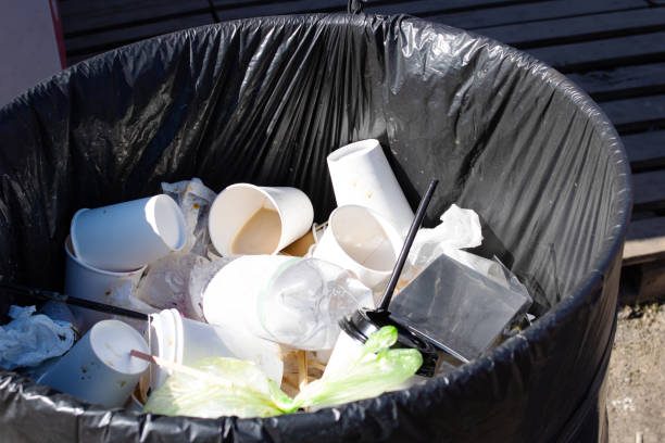 istock Plastic cups in a street trash can 1399625487