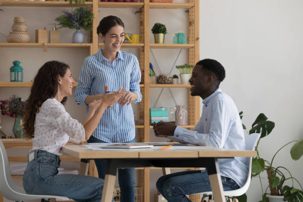 happy excited diverse employees working on project together - color image bus discussion expertise imagens e fotografias de stock