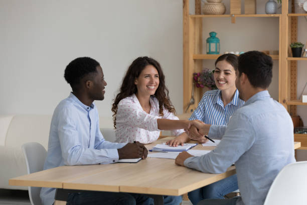 istock Happy diverse recruit team and job candidate shaking hands 1399627873