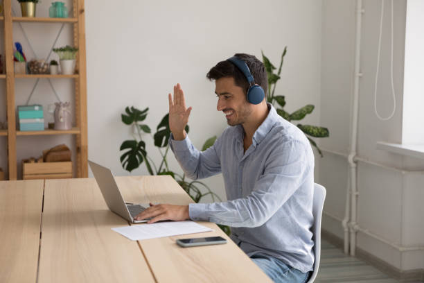 istock Happy professional in headphones talking on video conference talk 1399629026