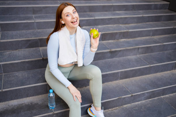 istock Sporty girl making an apple snack 1399634612