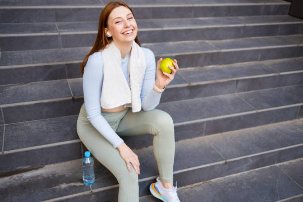 istock Sporty girl making an apple snack 1399634613