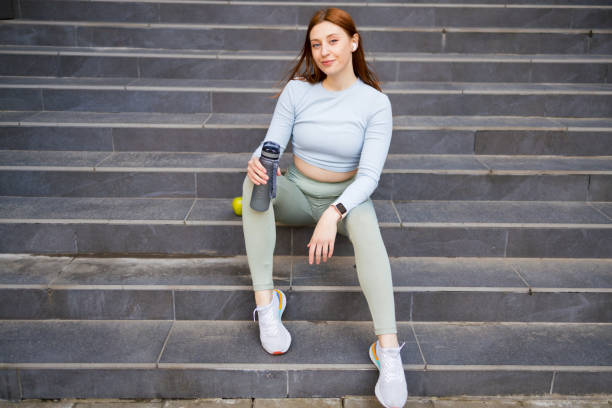 istock Sporty woman holding water 1399634638