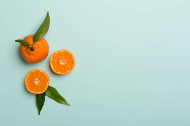 istock Flat lay with fresh mandarines on color background. Top view 1399634743