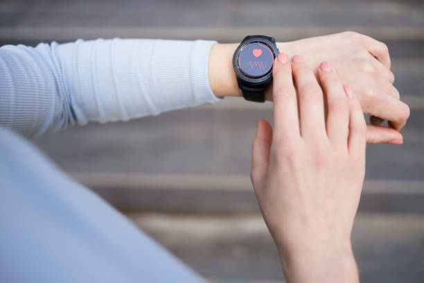 istock Woman looking at smartwatch 1399634899